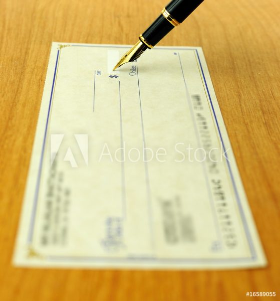 Blank check with someone about to fill it out