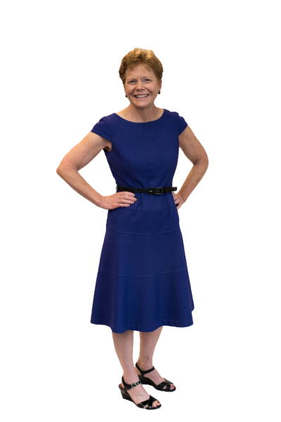 Nancy Watson standing with hands on hips, smiling