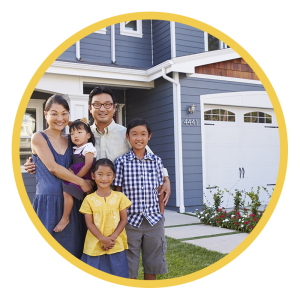 Family standing in front of a new home