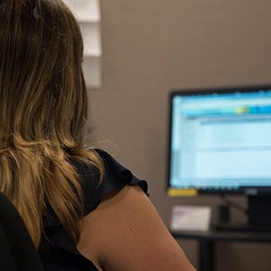 FSB team member working on computer in call center