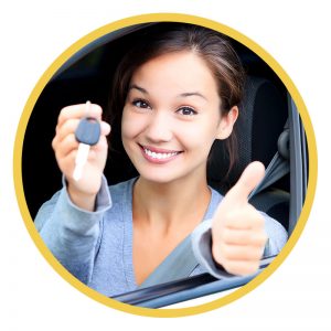 Women giving thumps up with car keys