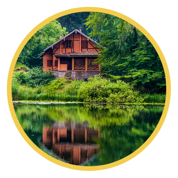 House on a lake surrounded by woods