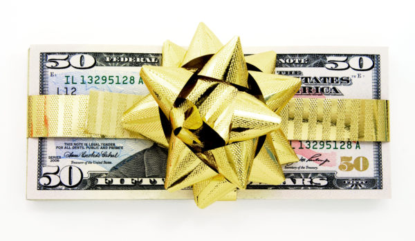 $50 bills wrapped in a gold bow