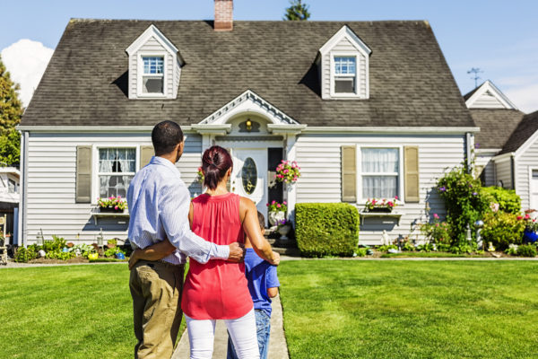 Family in front of home.