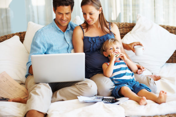Couple with laptop and son