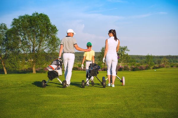 Family of three on a golf course