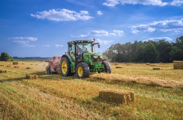 Photo of a tractor in the middle of a farm field