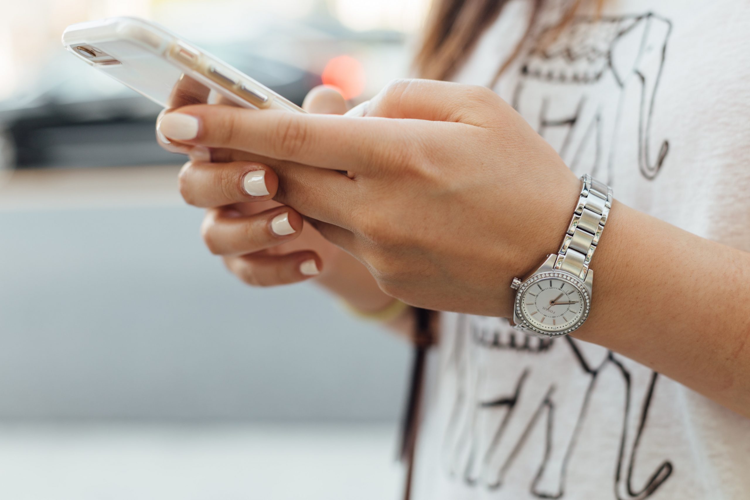 Woman typing on her phone