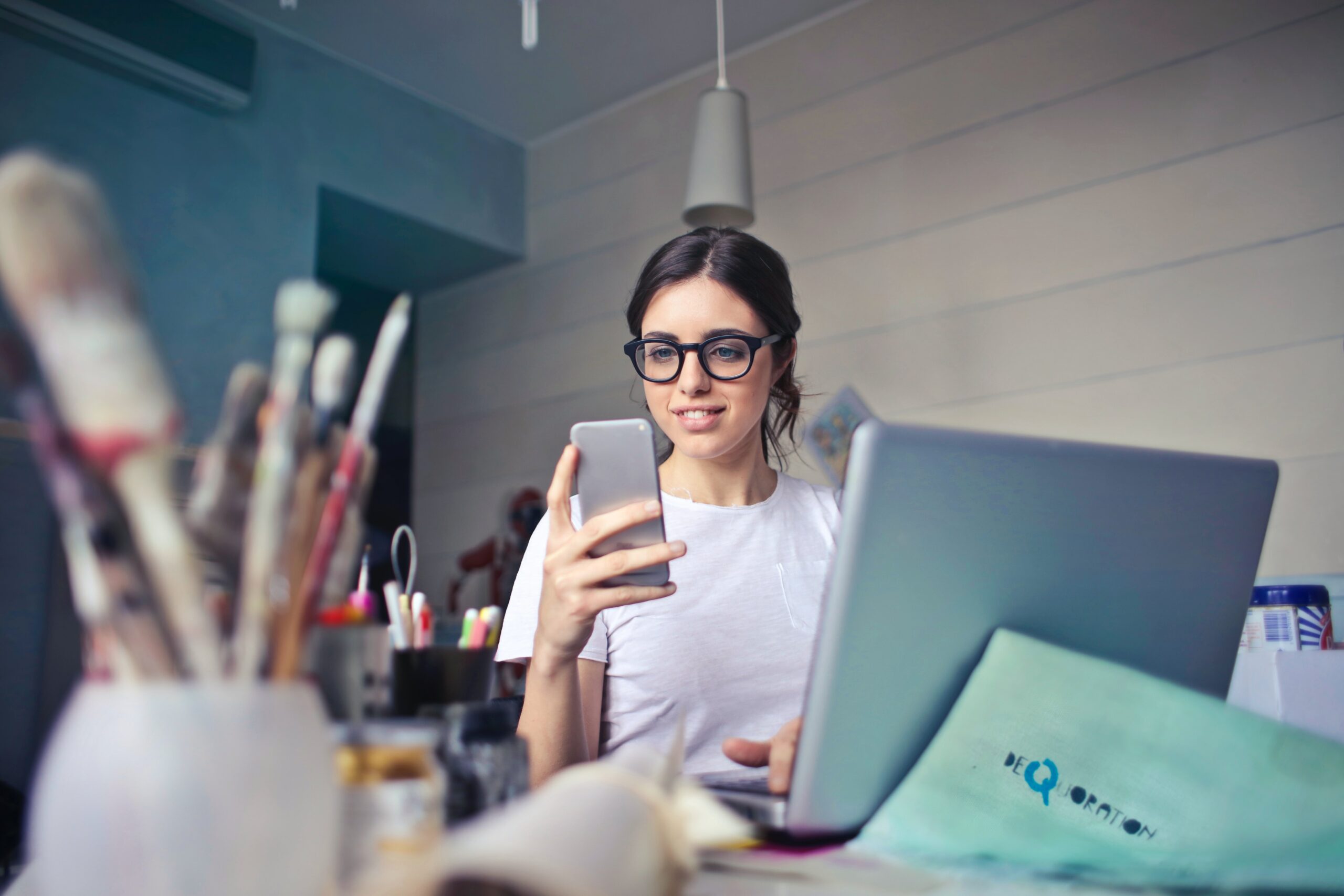 Woman business owner looking at cell phone