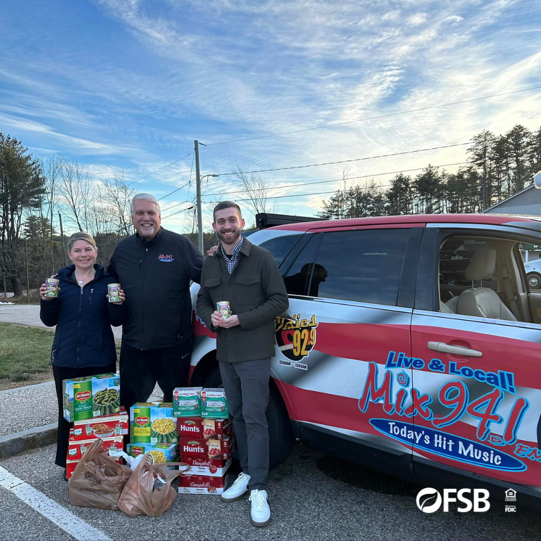 Photo of our Franklin team delivering canned goods for the 94.1 cash & cans food drive.