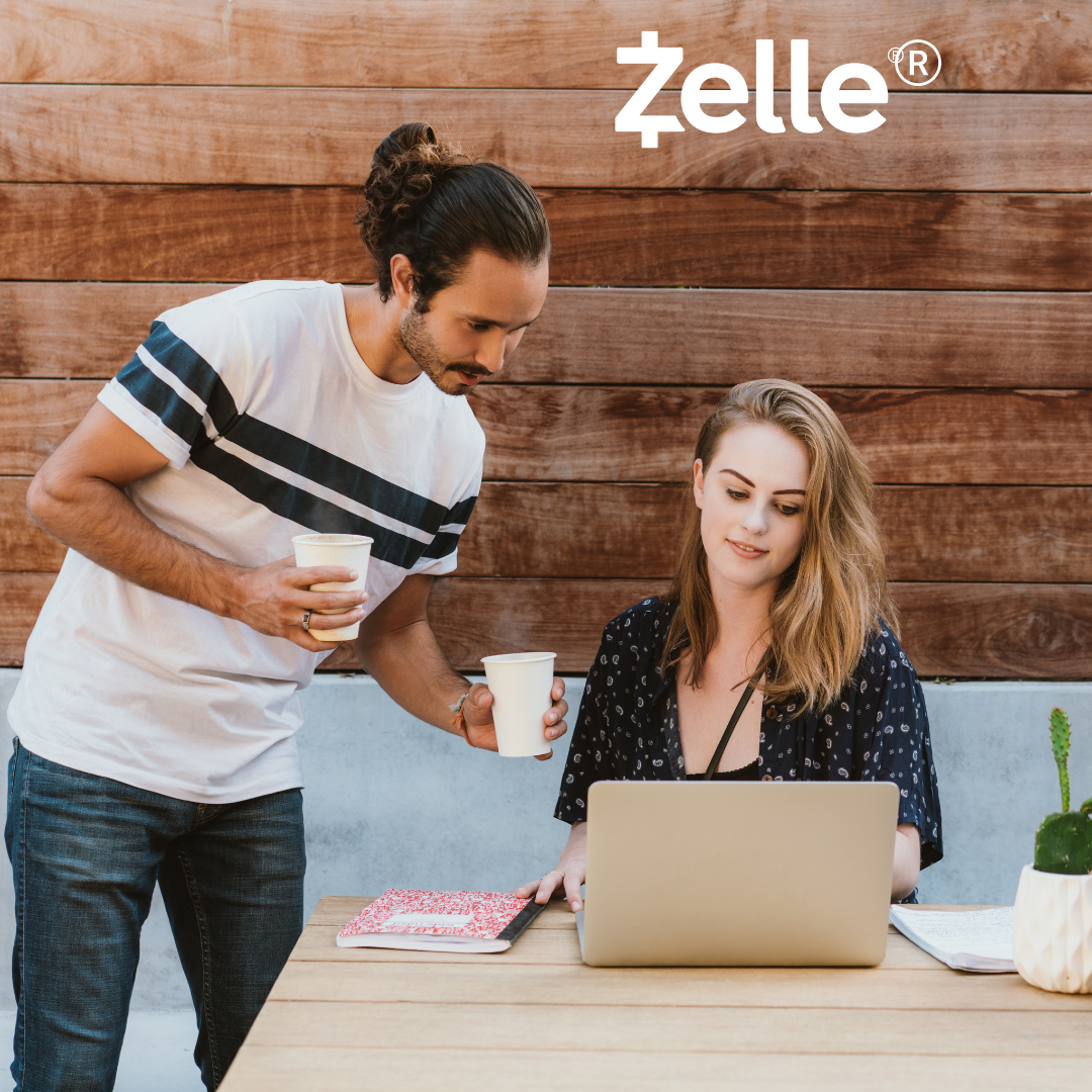 Man and a woman looking at a laptop screen for online banking