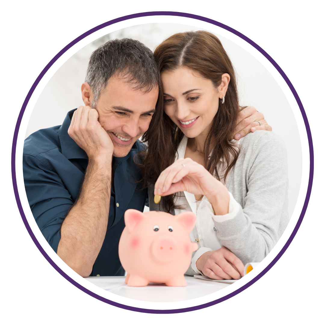 Couple putting money into a piggy bank