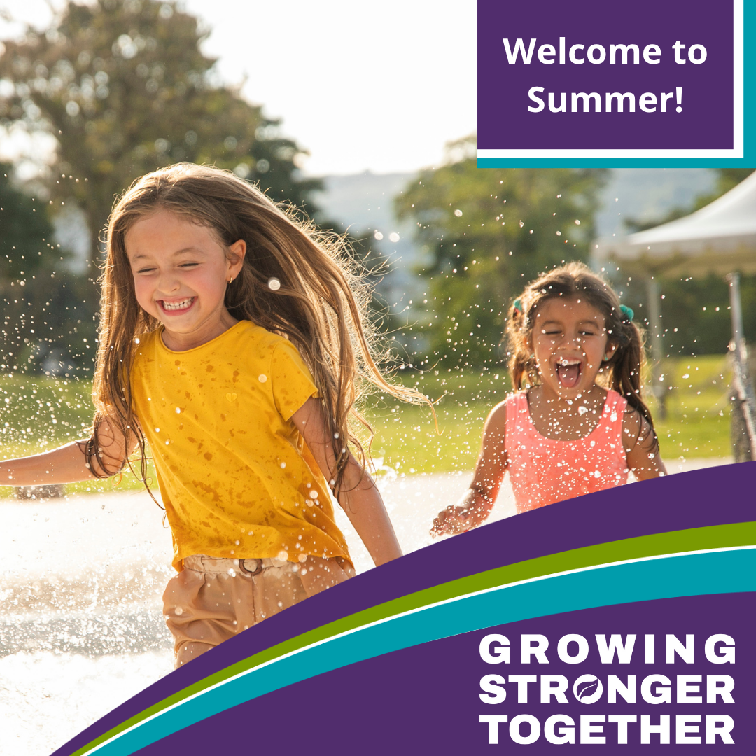 To little girls playing in the sprinkler