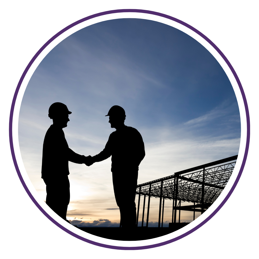 Two men at a construction site, shaking hands. Silhouette