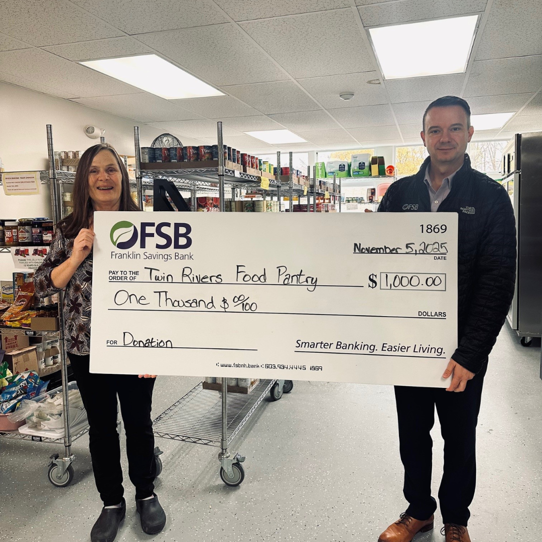 Alison Jones from Twin Rivers Food Pantry and Brian Bozak, FSB CEO at Twin Rivers Food Pantry with a check donation