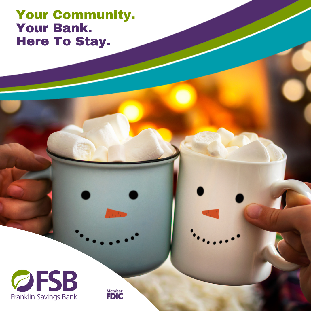 Two cups of Hot chocolate in front of a fire.