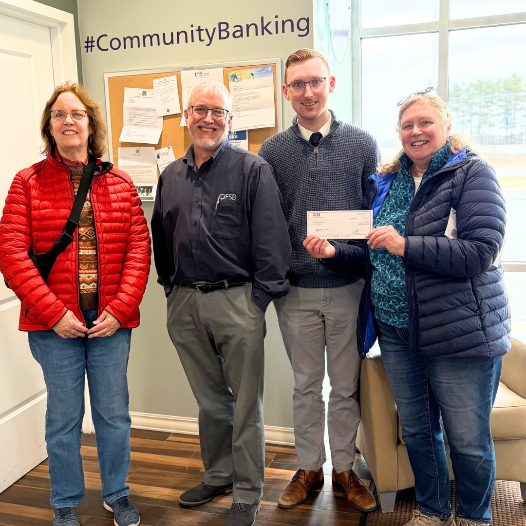 Mike Duval and Heather Capraro from from FSB with the Goffstown Junior Baseball