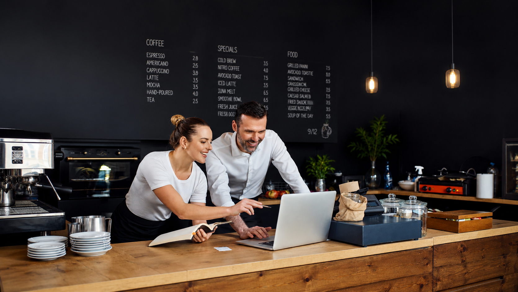 Two business people using online banking